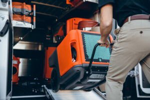 unloading water removal dryer for water damage removal - 911 Restoration in Eastern LA